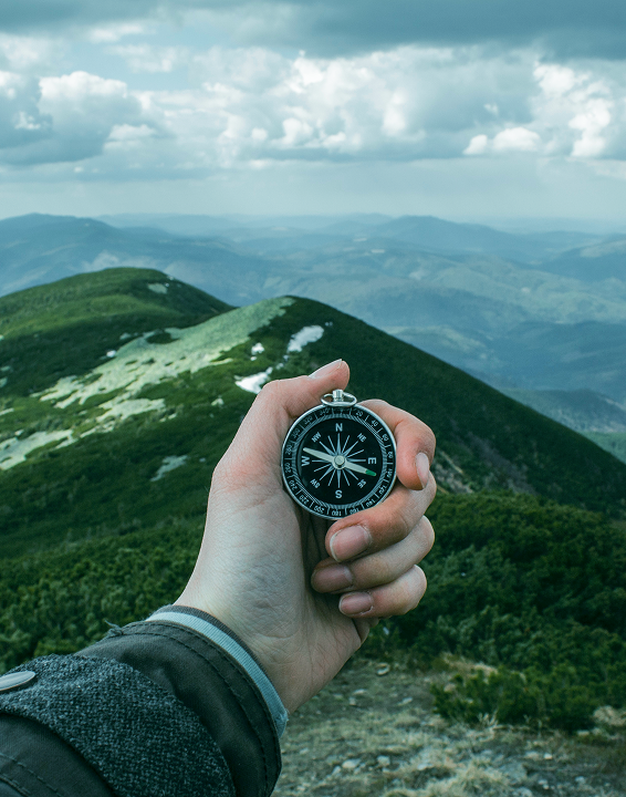 A man is walking on the top of a mountain